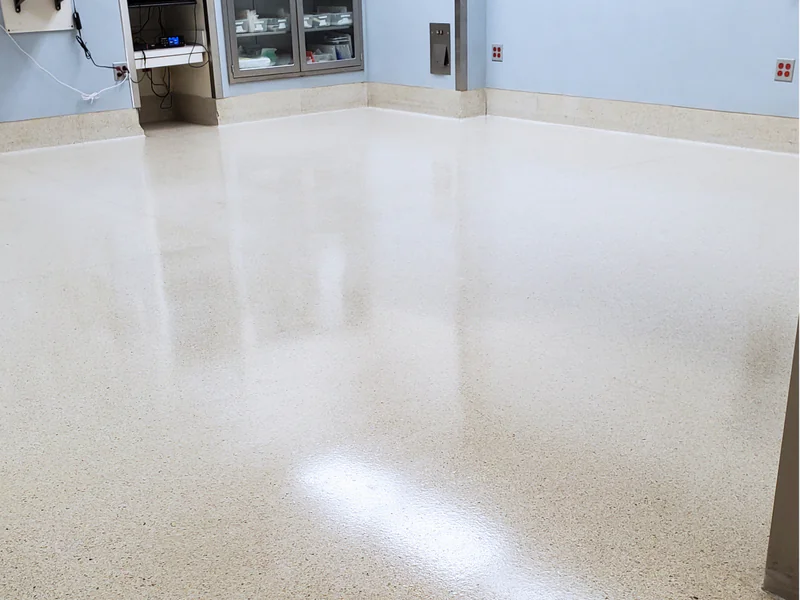 Professional floor finishing application showing long-lasting coating being applied to commercial flooring