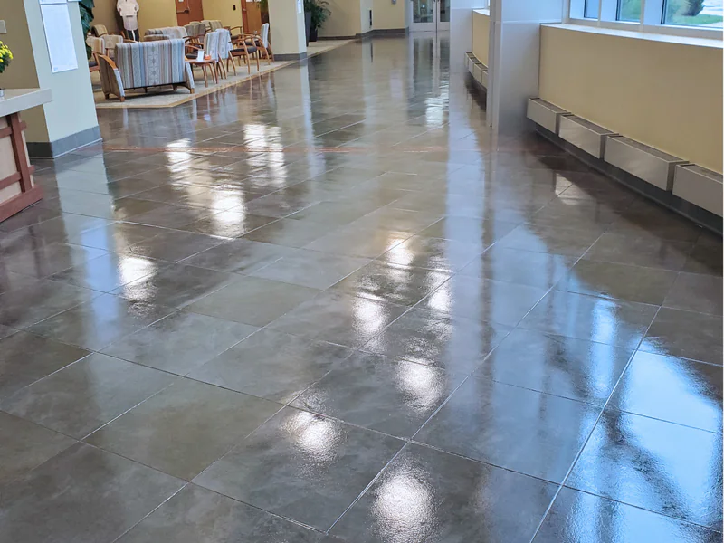 Professional LVT floor coating application showing luxury vinyl tile protection